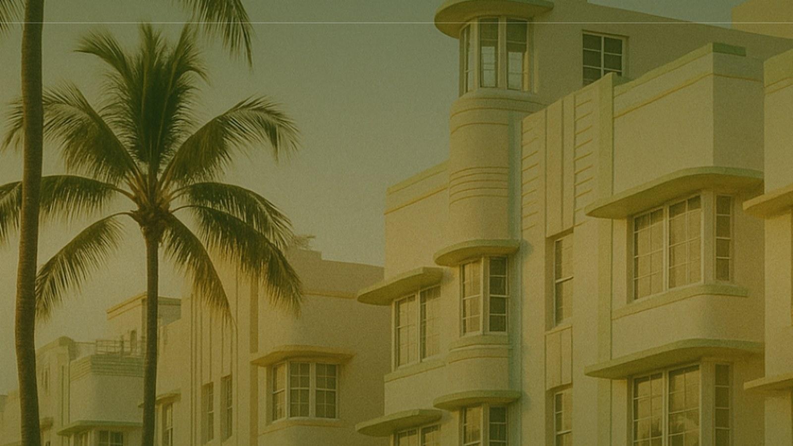 A waterfront Miami estate seen across Biscayne Bay in warm light