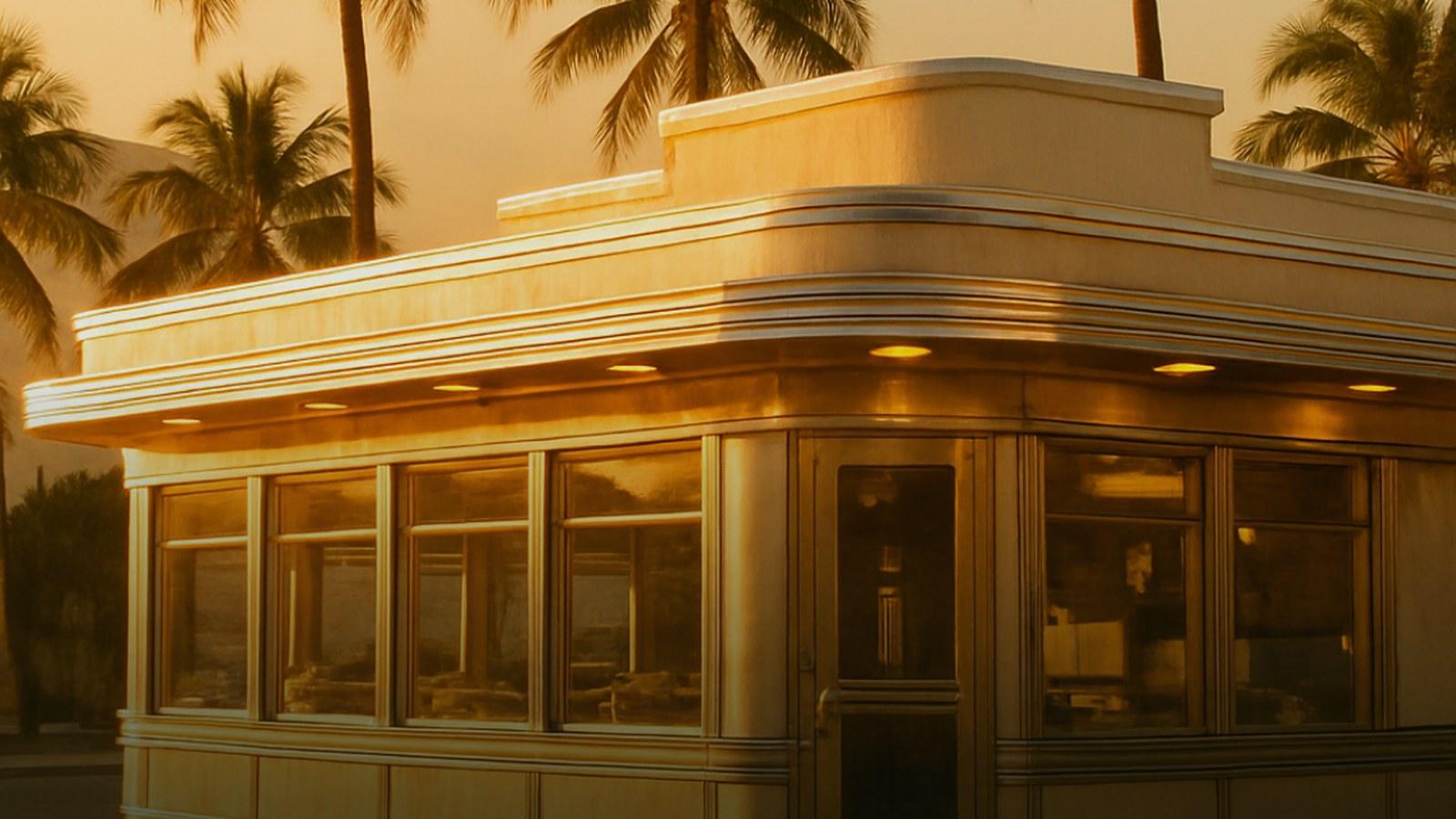 Warm golden light on a classic Collins Avenue corner in Miami Beach